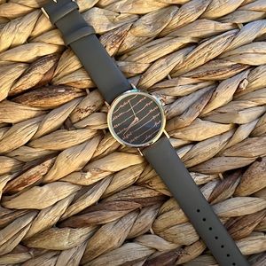 Rose gold watch with cursive letters